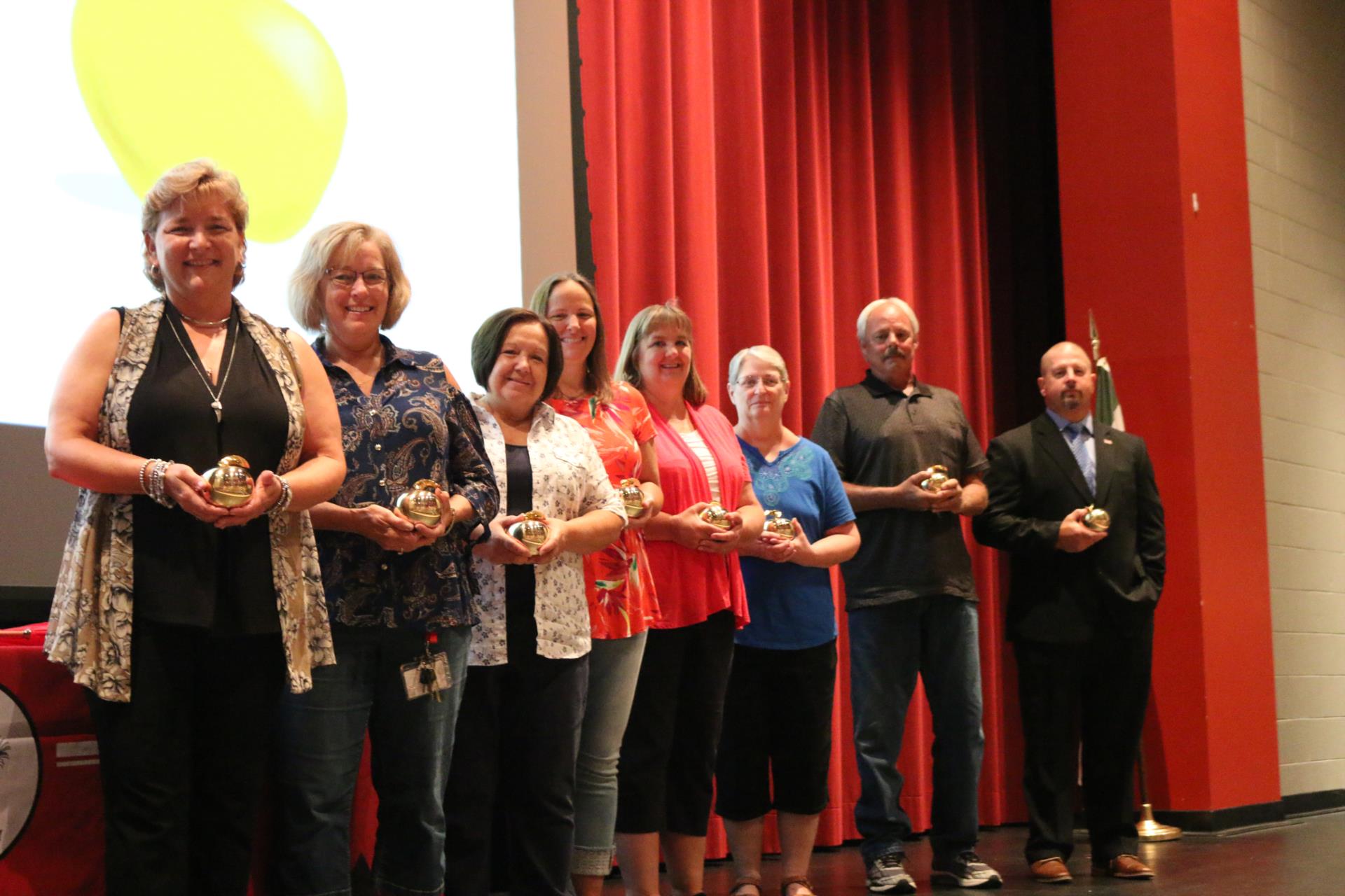 CCS golden apple recipients pose with their golden apple awards.