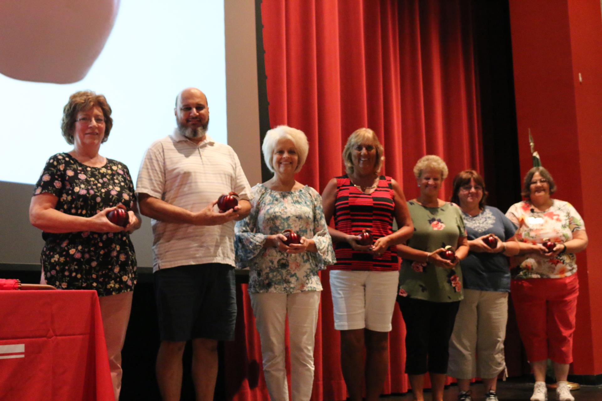 Crimson Apple recipients pose with their awards at the opening convocation.