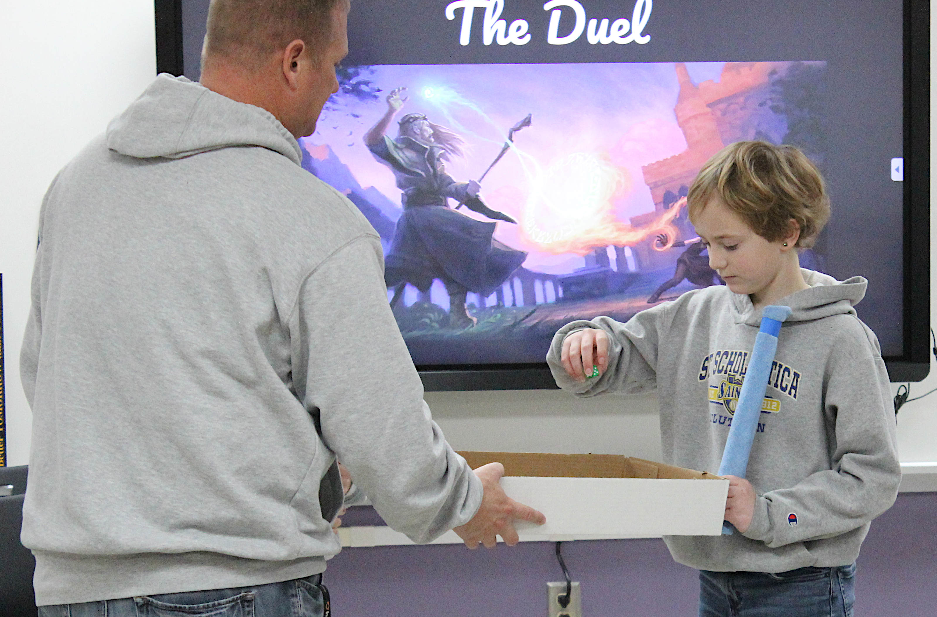 Students prepare for a duel in Mr. Killen's science class