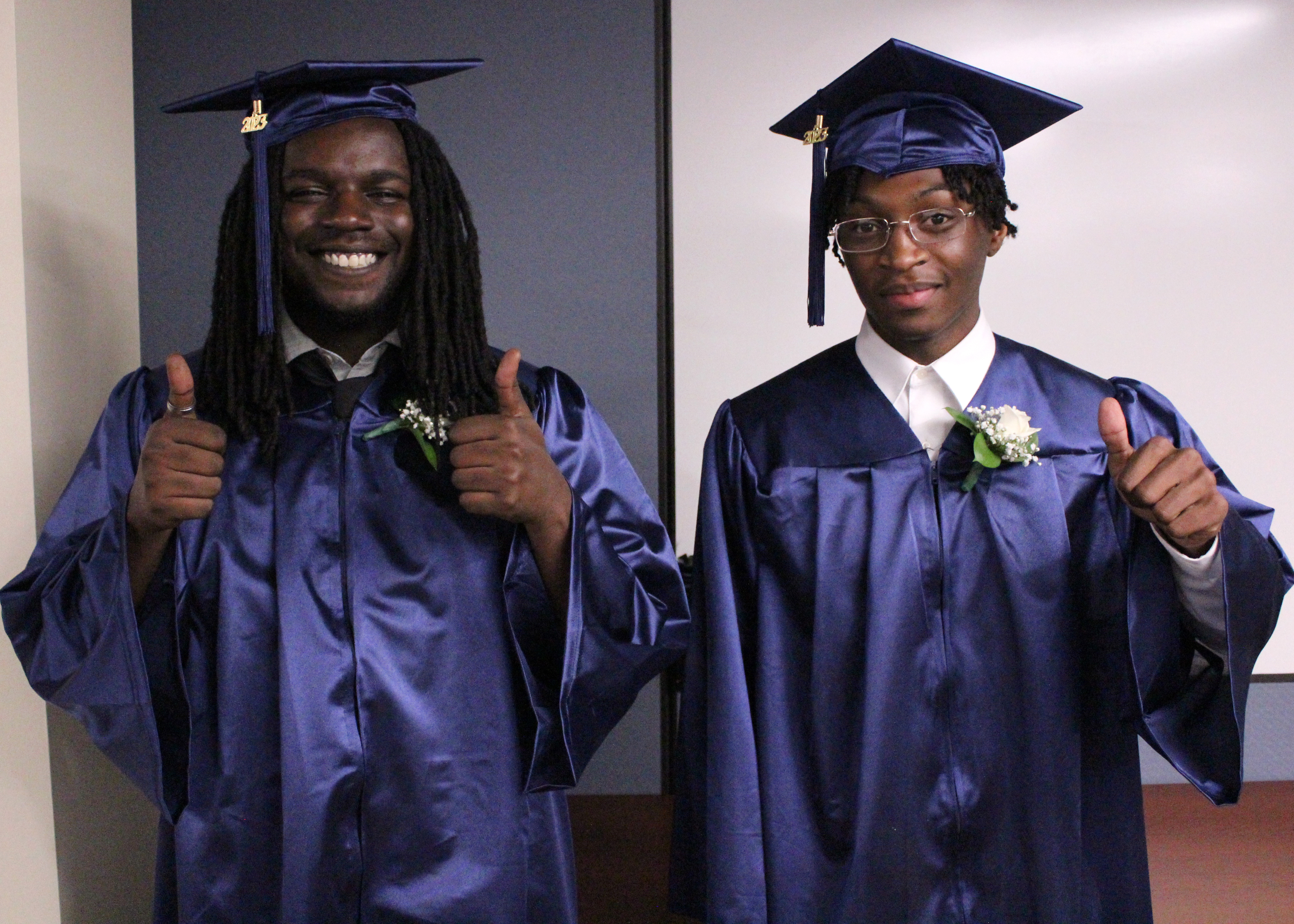 Two students in caps and gowns