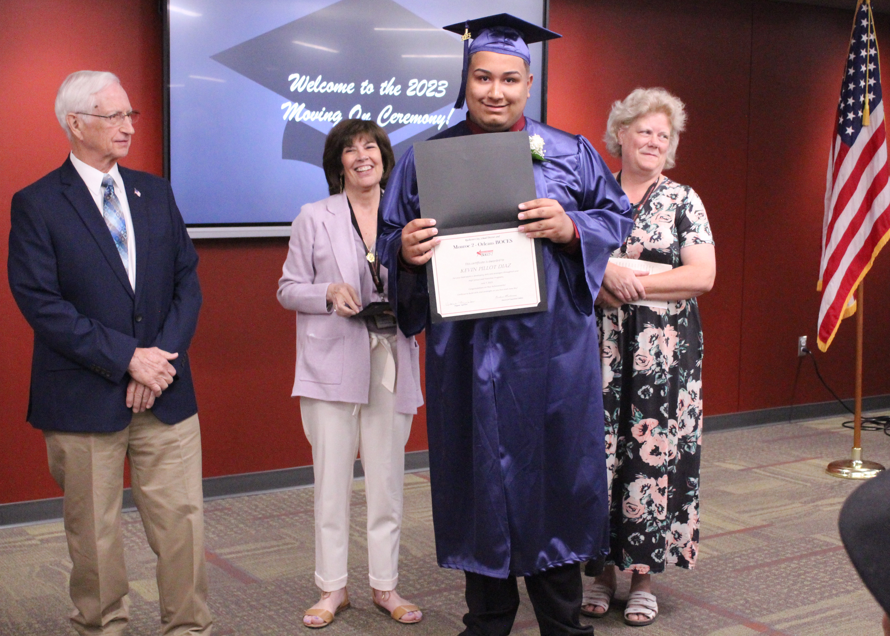 Student holding his certificate