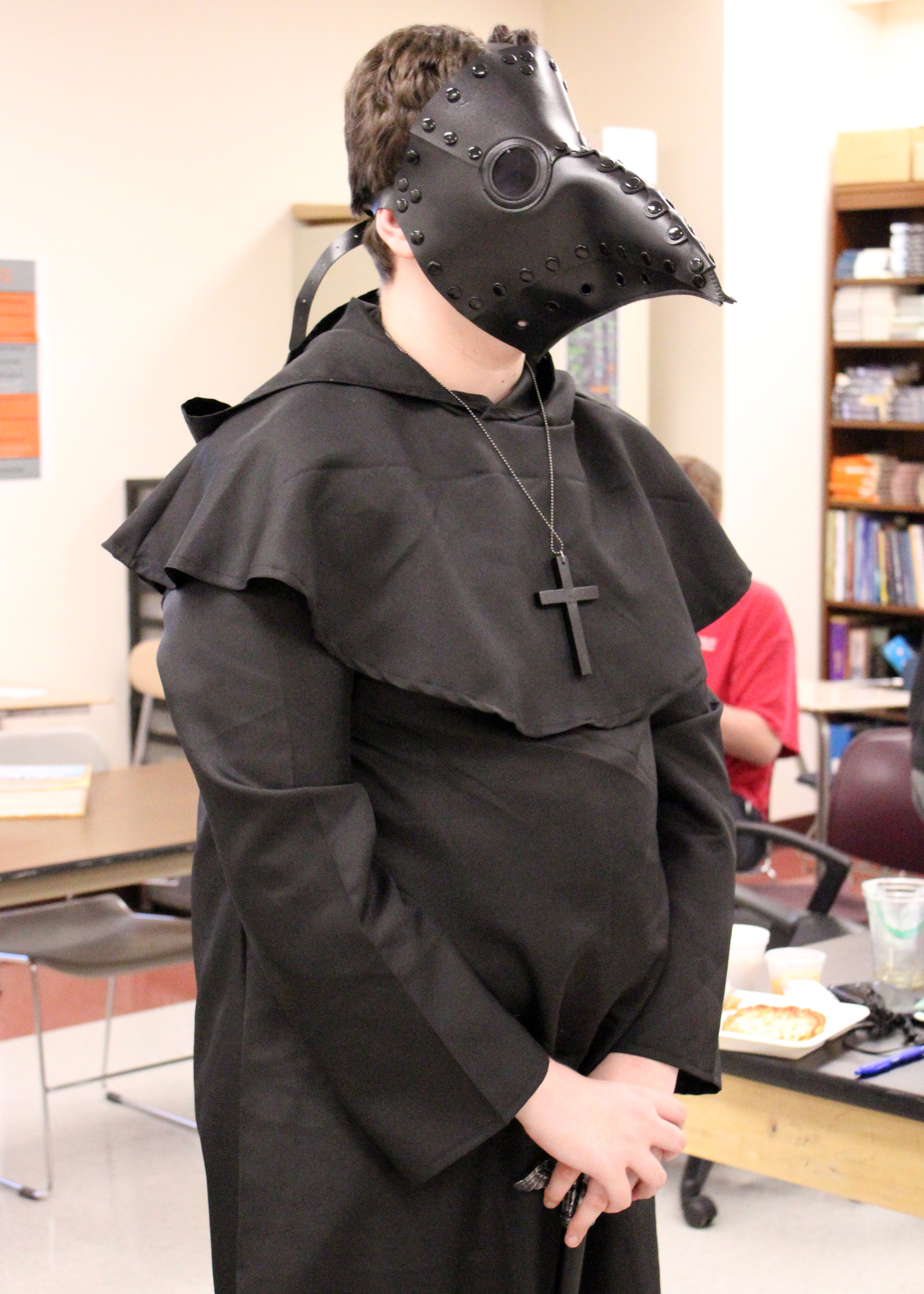 Student costumed with plague mask