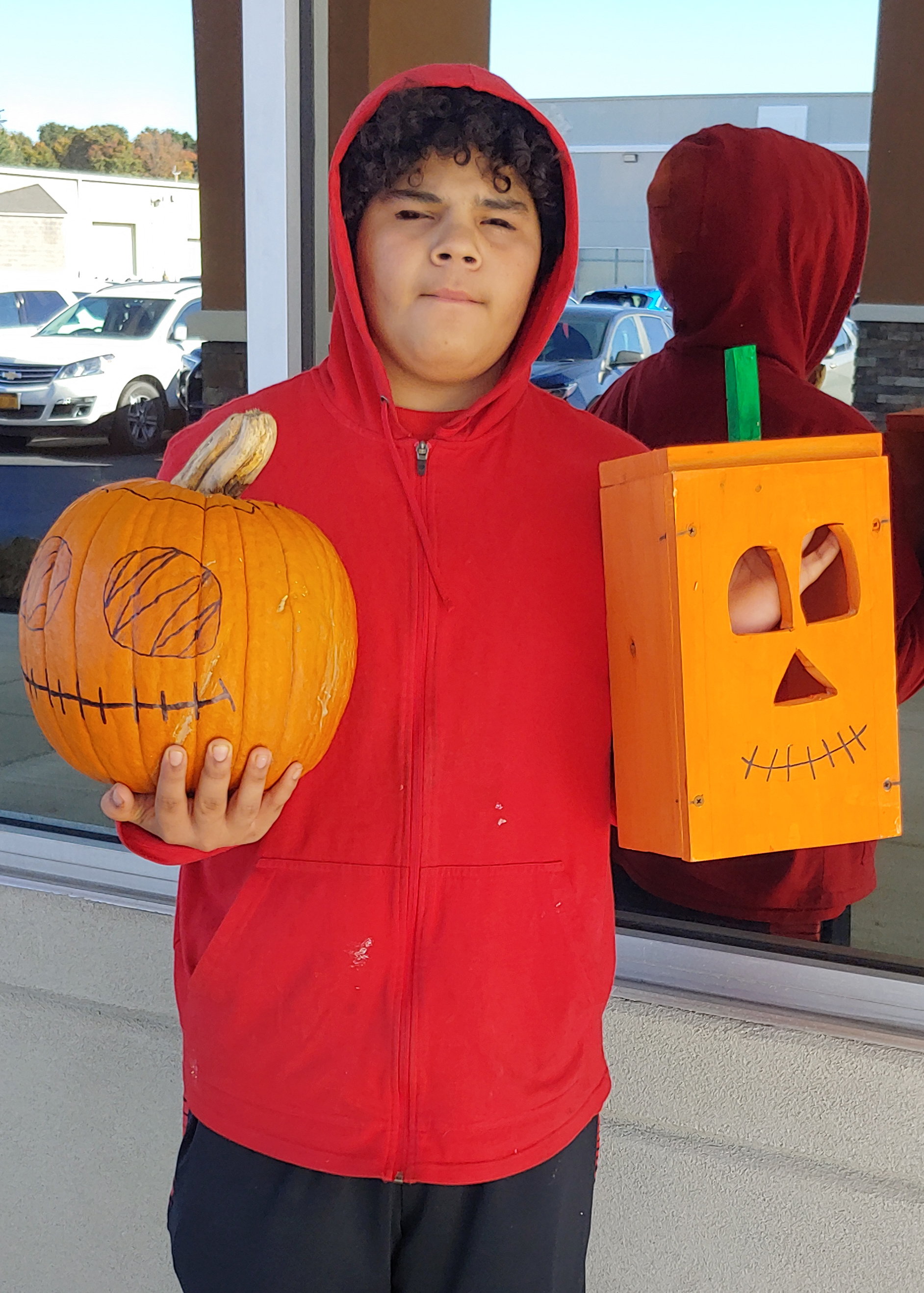 First-time carpenter Emanuel rose to the challenge, with an actual pumpkin decorated to match his carefully crafted wooden version.
