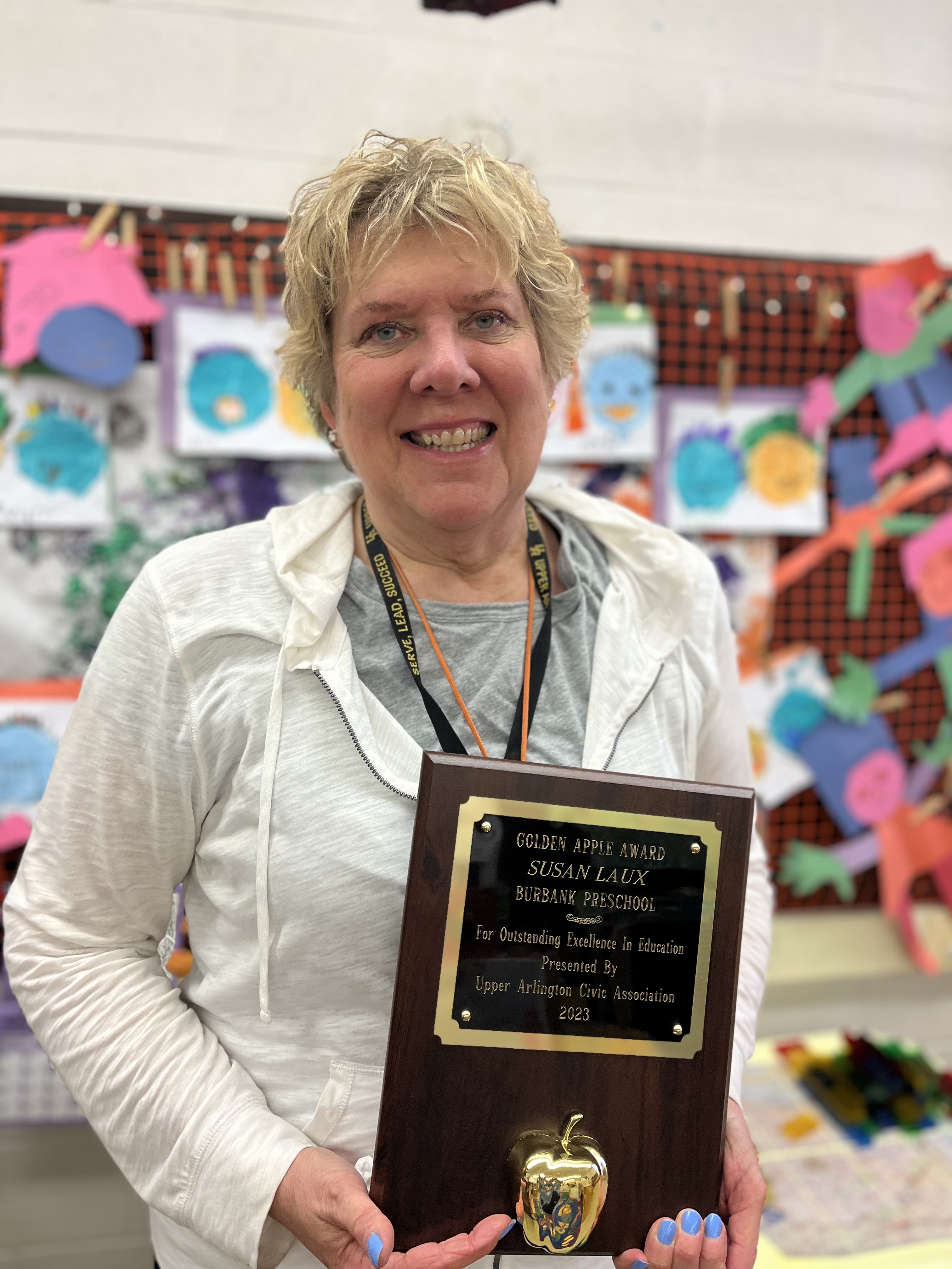 Susan Laux posing with her award